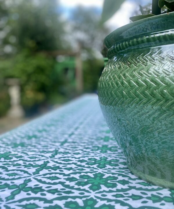 A bold, green outdoor tablecloth. Indian block print all-over design in vibrant pea green.