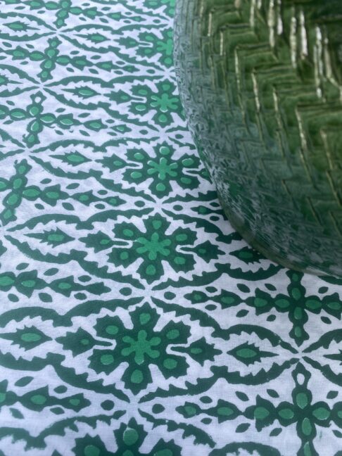 Vibrant green tablecloth, perfect for al fresco dining.