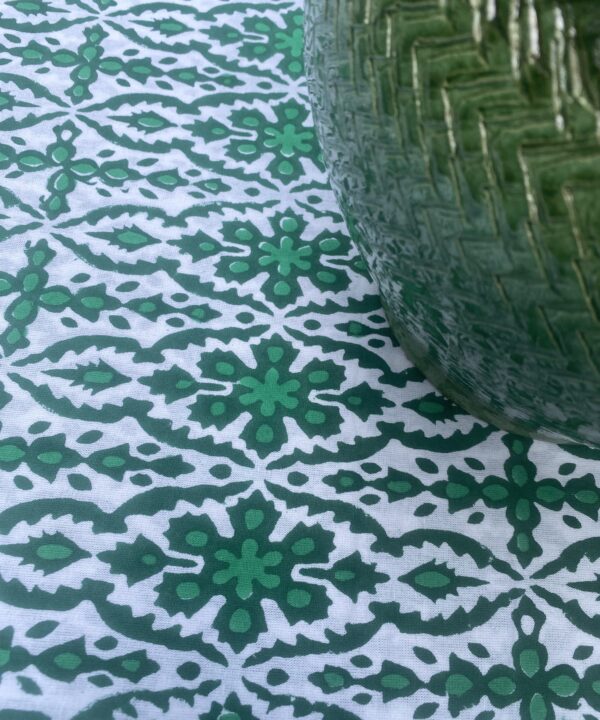Vibrant green tablecloth, perfect for al fresco dining.